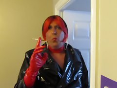 Chrissie smokes in red n ebony PVC