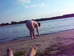 Plump big beautiful woman girel on a public beach