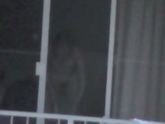 nude girlie in hotel window HI voyeur