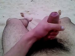 Cumming on public beach Bela Vista