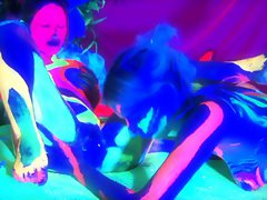 Surrealistic looking film with black light paint and lesbians