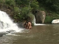 These nudist gay twinks like to bath under waterfall