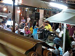 Turkish girl belly dancing in cafe
