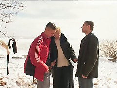 Irina with two guys on the snow