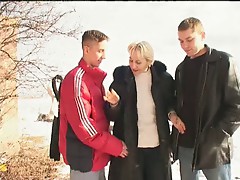 Irina with two guys on the snow