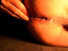 Crazy lady is giving a closeup POV on her ass with a glass toy