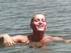 Kathia Nobili swimming naked at the water