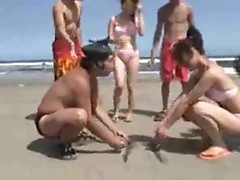 Japanese girls wrestling on the beach