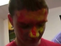 Sexy college students with their faces painted during a hazing
