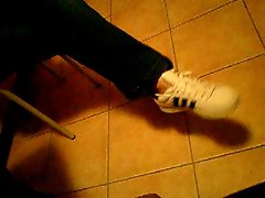 Sneakers young woman Dangling shoes adidas superstars