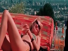 UMa ThurMan lying fAce down topless, in yellow bikini botToms on a Chair sunbathing, then getting up, putting on her bikini top giving us a brief glim