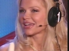 Pretty blond takes off panties in Howard TV studio