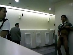 Man jacks of in public restroom for audience