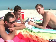 Hot gay threesome having fun under