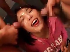 Japanese girl is in a bukkake scene where she blows and gets covered in cum