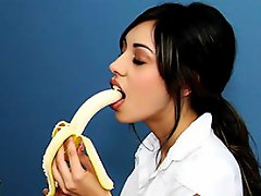 sexy brunette girl seduces her teacher by eating banana before...