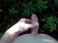 Jerking, moaning and shooting cum in the forest