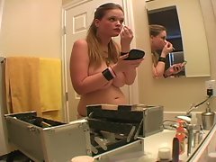 Topless curvy girl does her sexy makeup