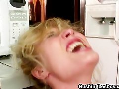 Lesbian dildo fucking in kitchen