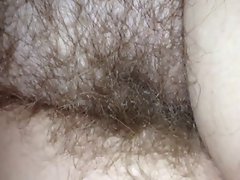 close up of my girls hairy pussy under the sheets.